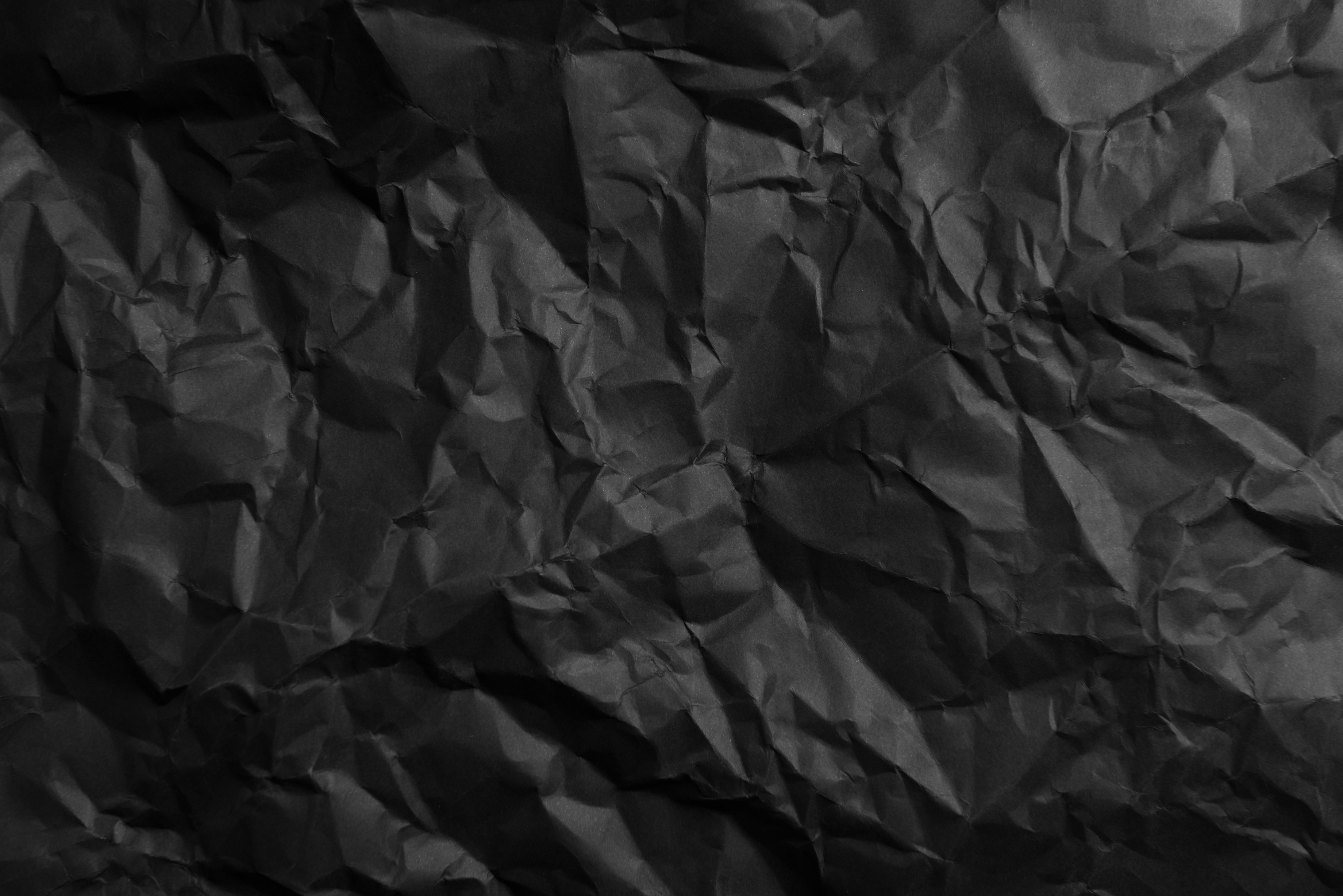 Crumpled black paper Horisontal